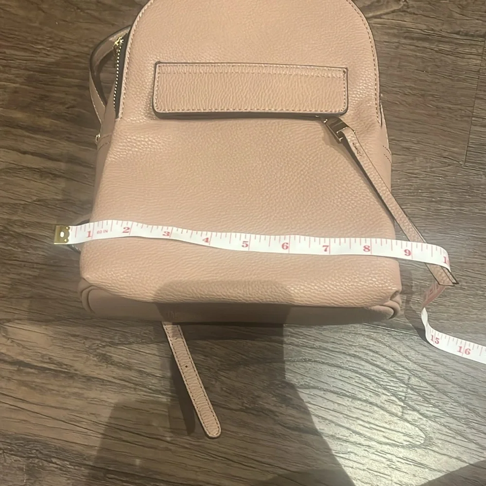 small pink faux leather backpack